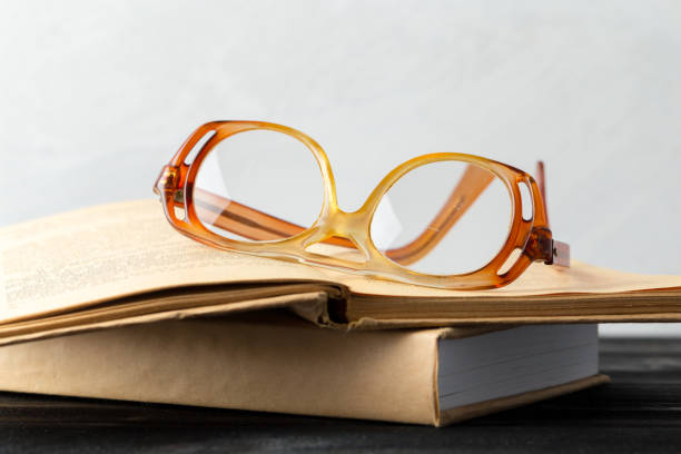 istock eyeglasses and book on the table 1151196402