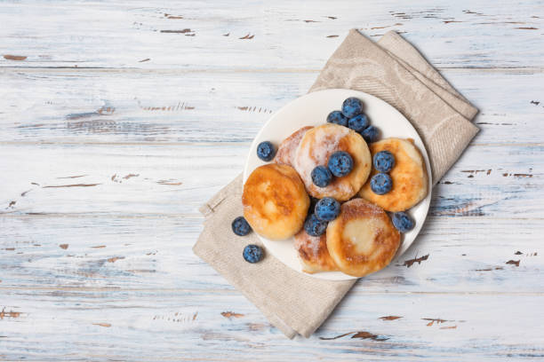 istock Tasty cottage cheese pancakes with blueberries 1151197773