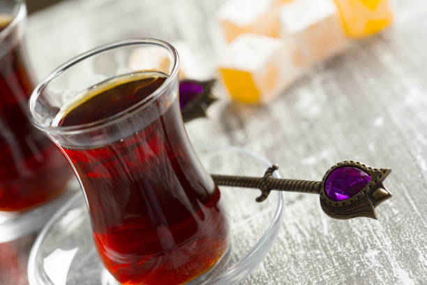 istock Red tea in turkish glasses on a wooden table 1151198213