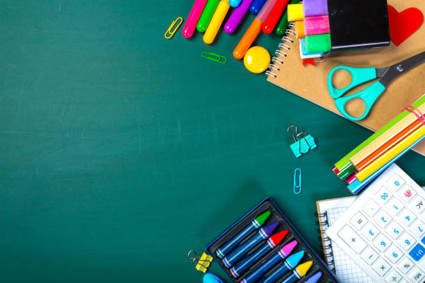 istock School and office supplies on blackboard 1151198253