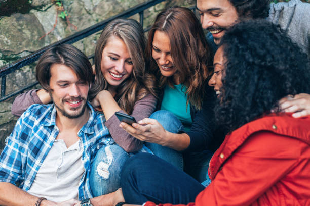 istock Multi-ethnic group of friends with smart phone 1151198426