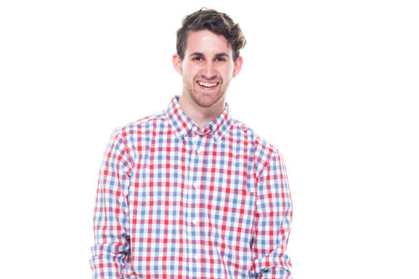 istock Attractive young man wearing a checked shirt and jeans - using a laptop 1151198751