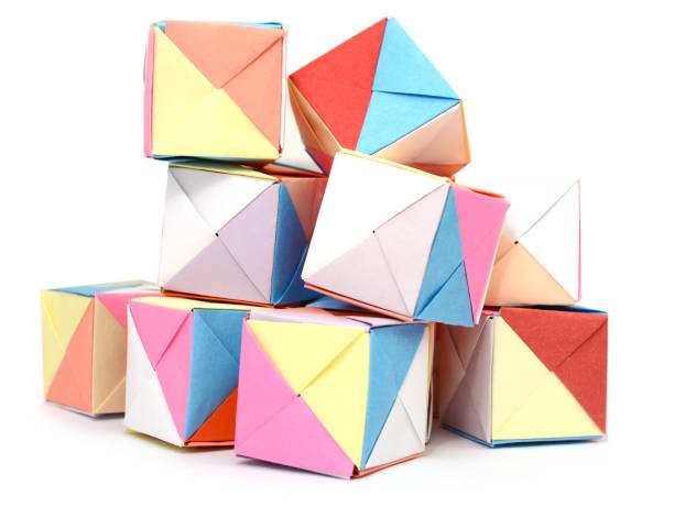 istock Folding origami cubes, colorful paper 1151200042
