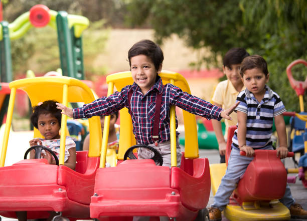 istock Children having fun playing on toy rides 1151203687