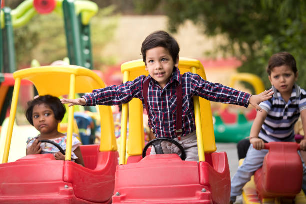 istock Children having fun playing on toy rides 1151203731