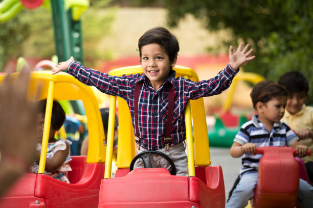 istock Children having fun playing on toy rides 1151203780
