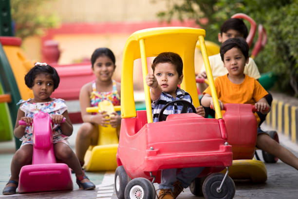 istock Children having fun playing on toy rides 1151204055