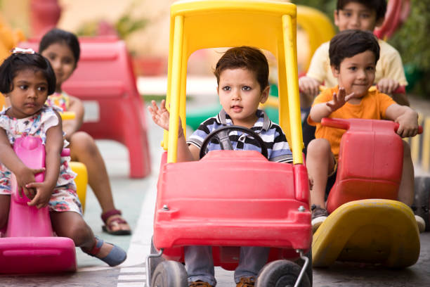 istock Children having fun playing on toy rides 1151204192