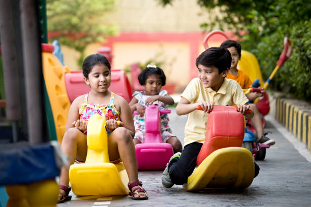 istock Children riding toy rocking horse 1151204236