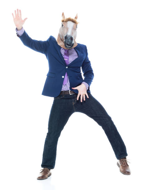 istock Businessman with horse mask is dancing 1151204663
