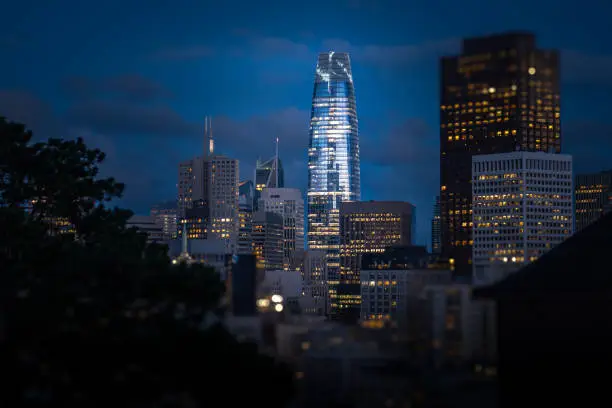 The new Salesforce Tower towering above the other skyscrapers in San Francisco at dusk on a clear night. Financial district skyline.