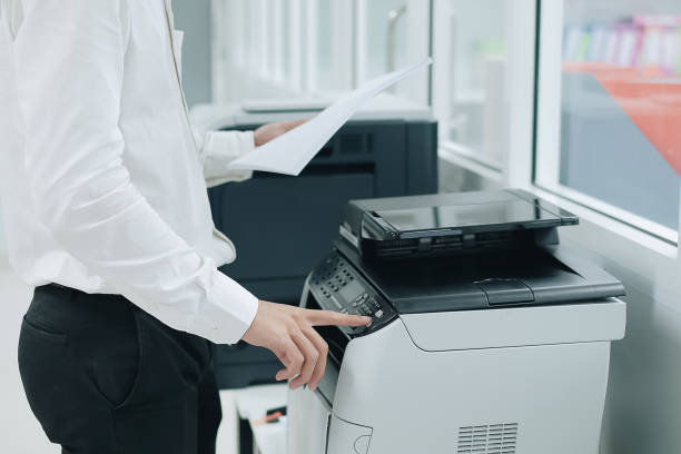 istock Bussiness man Hand press button on panel of printer scanner or laser copy machine in office 1151207788