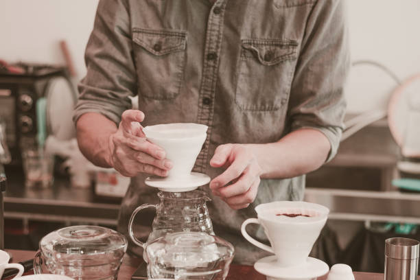 istock Cafe barista making specialty coffee with coffeee filter  in a cafe 1151210558
