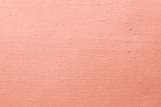 istock pink cement wall background close up 1151210901