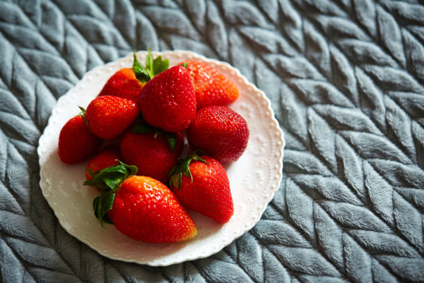 strawberry on a plate stock photo