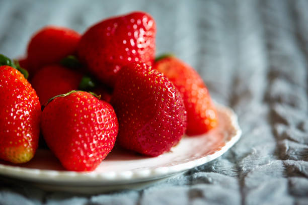 strawberry on a plate stock photo