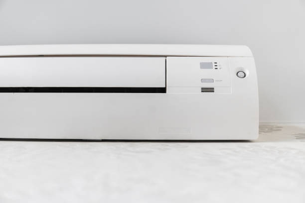 istock White air conditioner system on white wall in a room. 1151212243