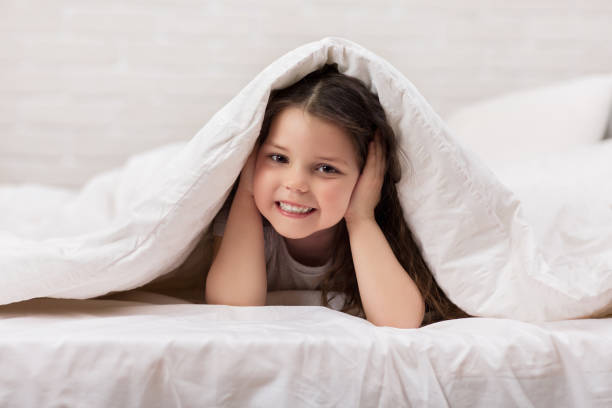 istock happy morning baby in bed. 1151215145