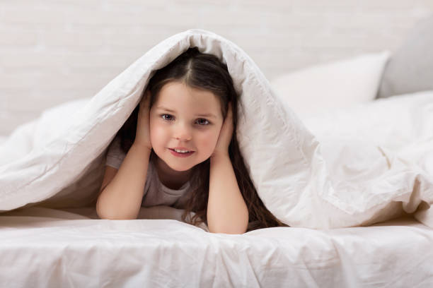 istock happy morning baby in bed. 1151215171