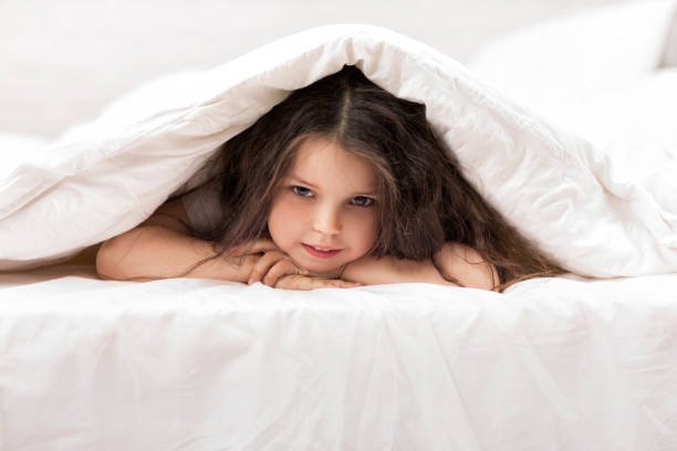 istock happy morning baby in bed. 1151215188