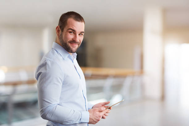 istock Man in the business center with tablet computer 1151215354