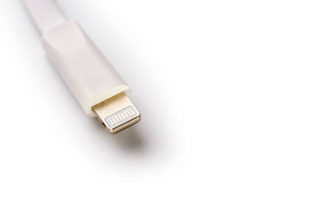 istock Connector lightning on a white background. This is a proprietary connector used to connect mobile devices to well-known host computers 1151218296