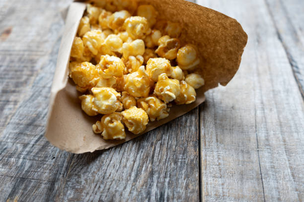 istock Sweet popcorn with caramel in paper bag 1151220676
