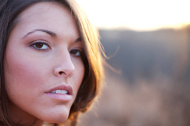 istock young woman winter sunset portraits 115122086