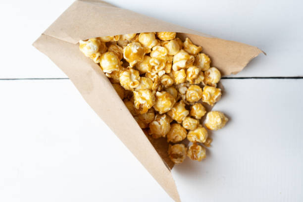 istock Sweet popcorn with caramel in paper bag 1151221286