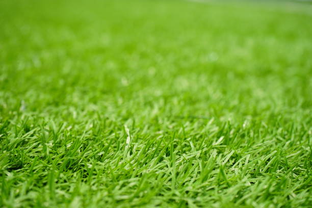 патч зеленого искусственного газона - soccer soccer field artificial turf man made material стоковые фото и изображения