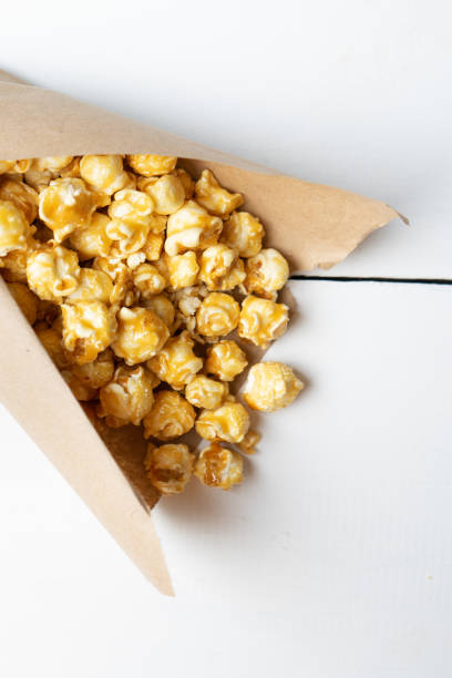 istock Sweet popcorn with caramel in paper bag 1151222153