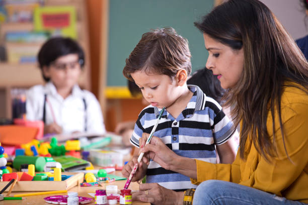 istock Children with teacher in art class 1151224123