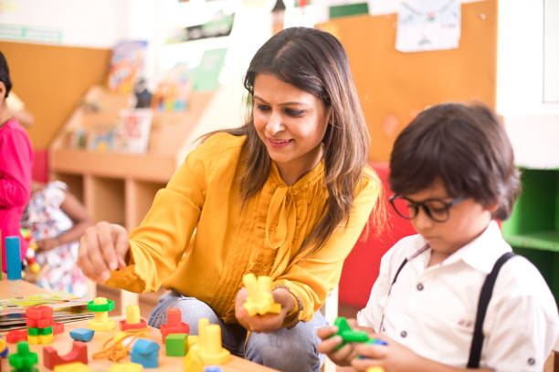 istock Teachers with children learning at preschool 1151224267