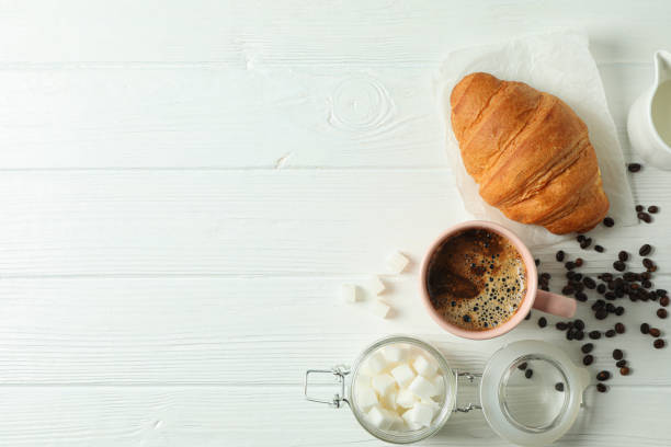 istock Coffee time accessories on white wooden background, space for text. Break time 1151224890