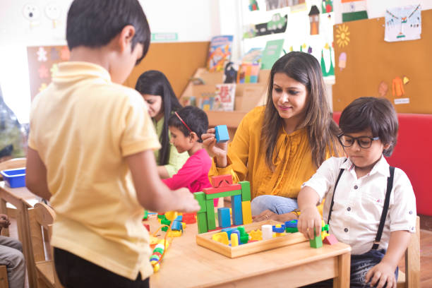 istock Teachers with children learning at preschool 1151225206