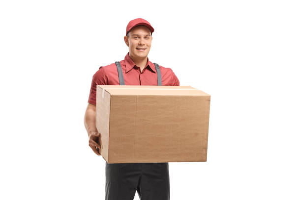 istock Delivery man holding a cardboard box 1151225676