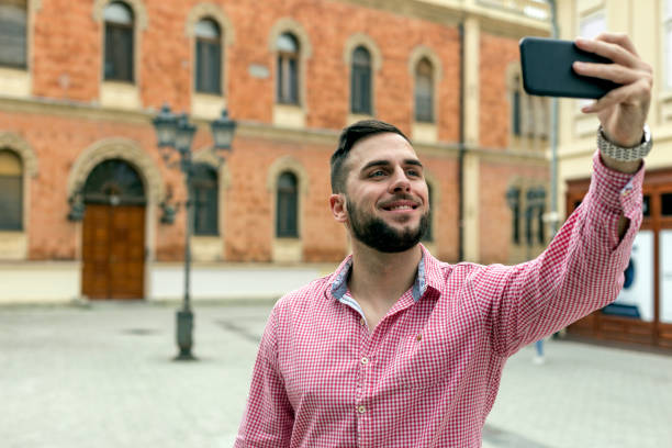 istock Happy young man taking selfie 1151225898