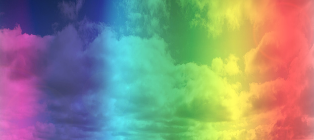 LGBT rainbow gay flag over sky background. space for text colorful