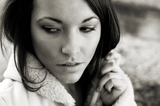 istock young woman winter sunset portraits 115122736