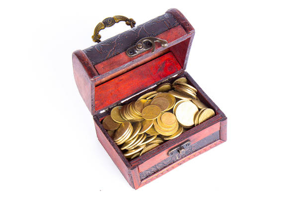 istock Open chest with coins isolated on white background 1151227628