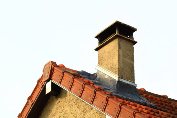Roof with aligned edge and ridge tiles and red pediment