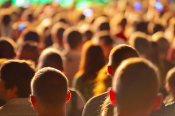 istock heads of fans during a musical performance. 1151236263