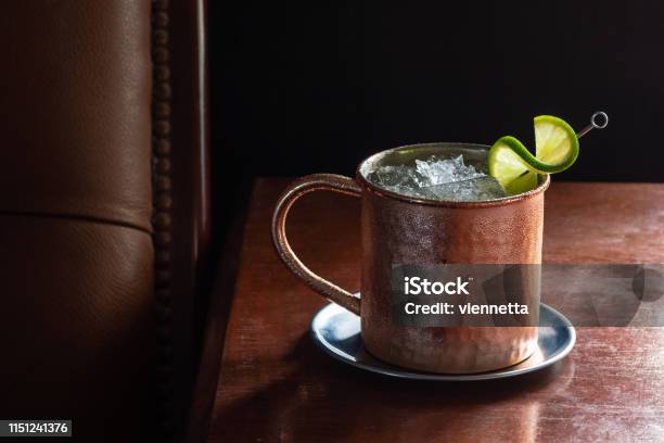 Moscow Mule Cocktail In Copper Mug In Dark Luxurious Bar With Copy Space Stock Photo - Download Image Now