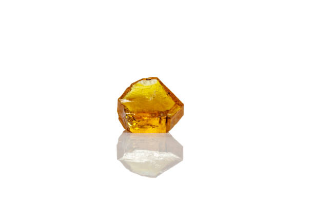 istock Macro yellow diamond mineral stone on white background 1151244431