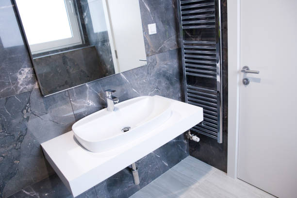 istock Modern bathroom interior with sink and faucet 1151246541