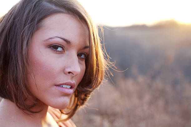 istock young woman winter sunset portraits 115124666