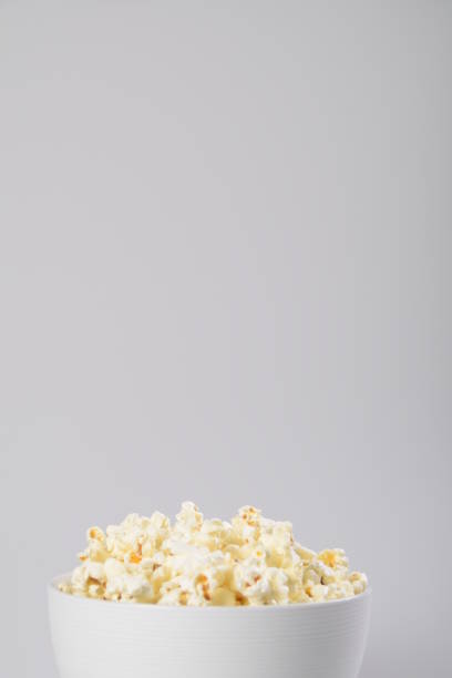 istock Bowl of popcorn isolated on white background. 1151250381