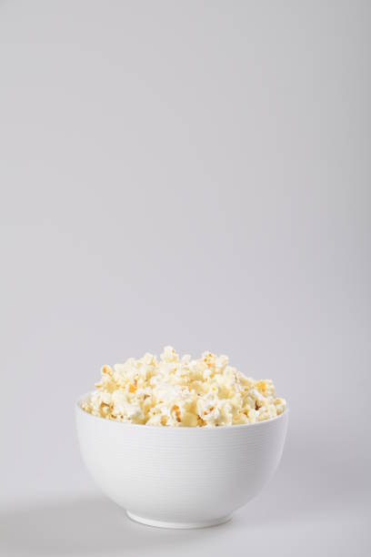 istock Bowl with popcorn. Isolated on white background. 1151250382