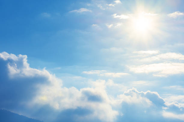 blue sky with sun and clouds blue sky with sun and clouds. beautiful bright nature scenery sunny day stock pictures, royalty-free photos & images