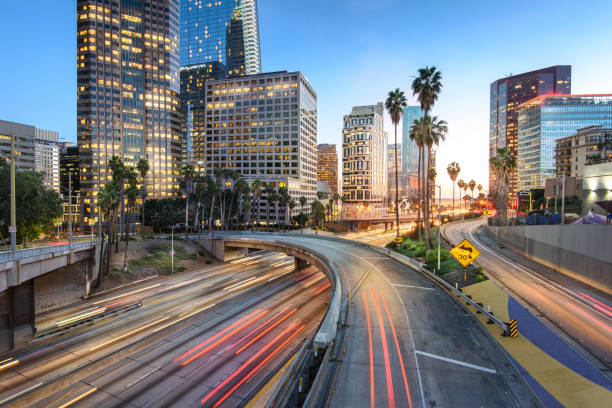 istock Downtown Los Angeles at sunset with car traffic light trails 1151254513
